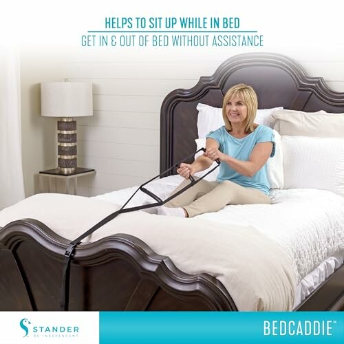 Woman using a bed assist device to sit up in bed.