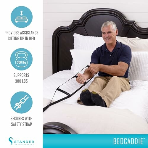 Man using a bedcaddie for assistance sitting up in bed, supports 300 lbs, features a safety strap.