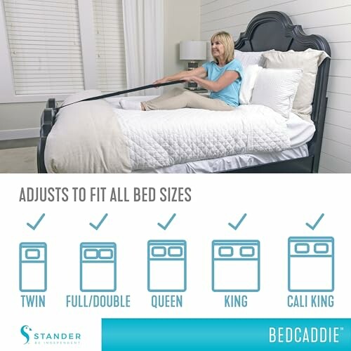 Woman using a BedCaddie strap on a bed, suitable for various bed sizes.