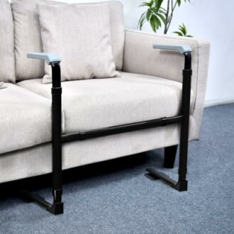 Safety rails installed on a couch for support.