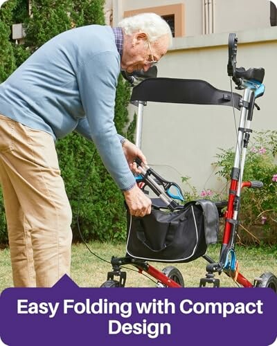 Elderly man folding a walker in a garden.