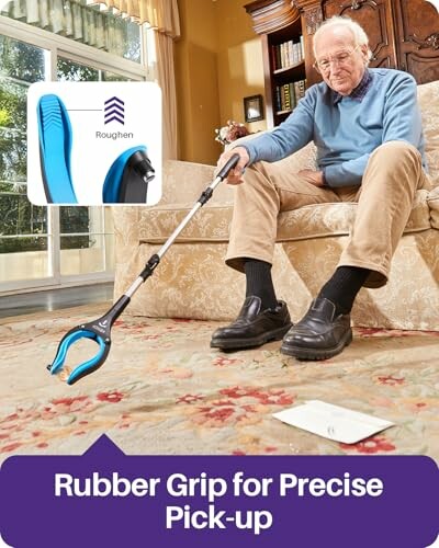 Elderly man using a reacher tool to pick up an envelope from the floor.